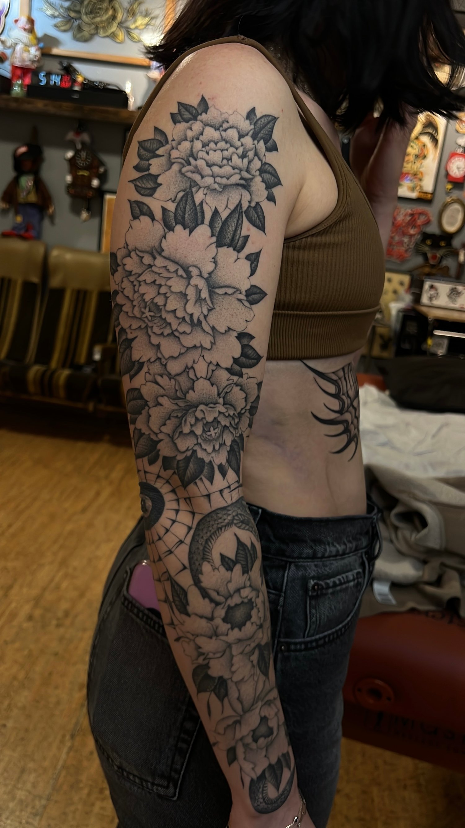 Fineline black and grey stippled tattoo of a floral sleeve, Portland, Oregon