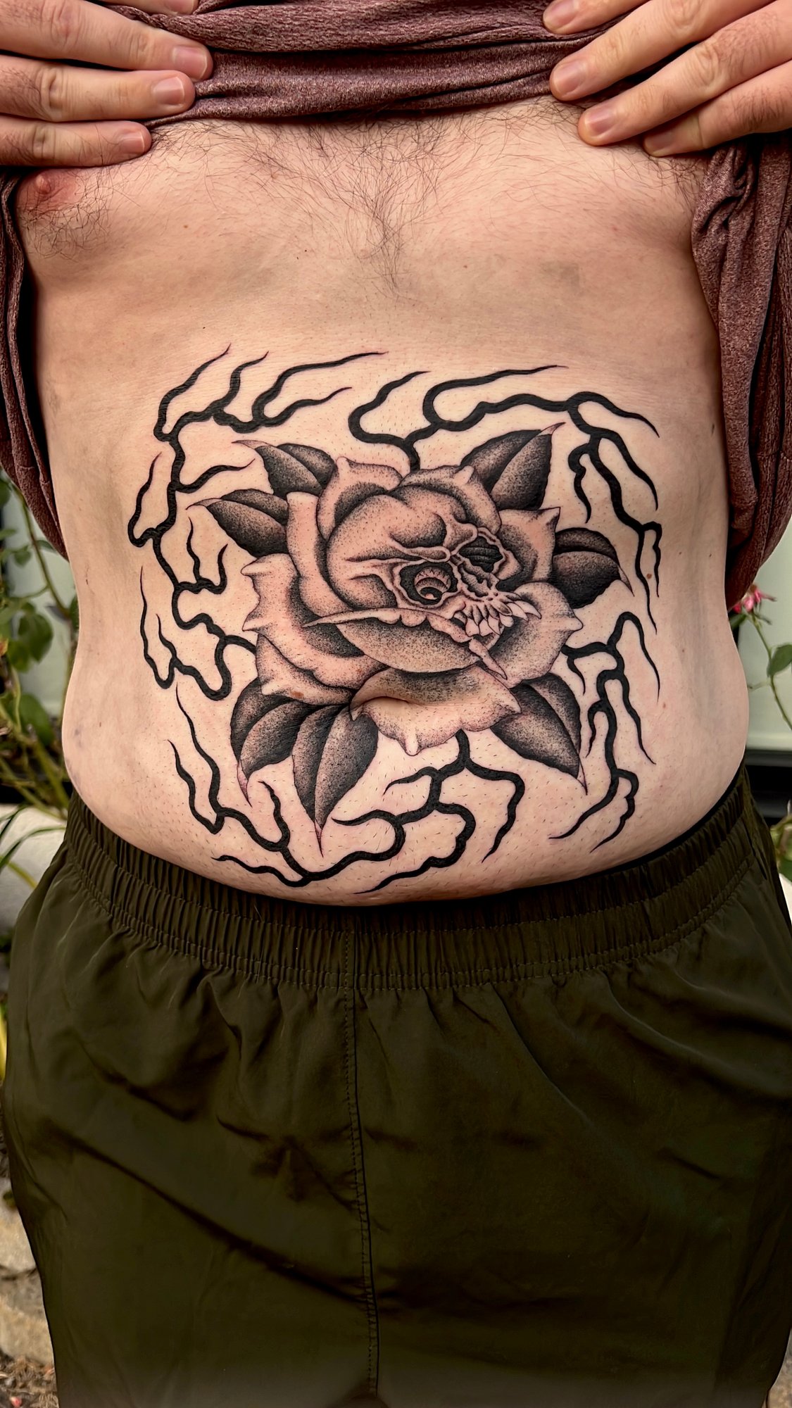 Fineline black and grey stippled tattoo of a flame skull, Portland, Oregon